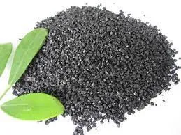 Dark humic acid granules with green leaves